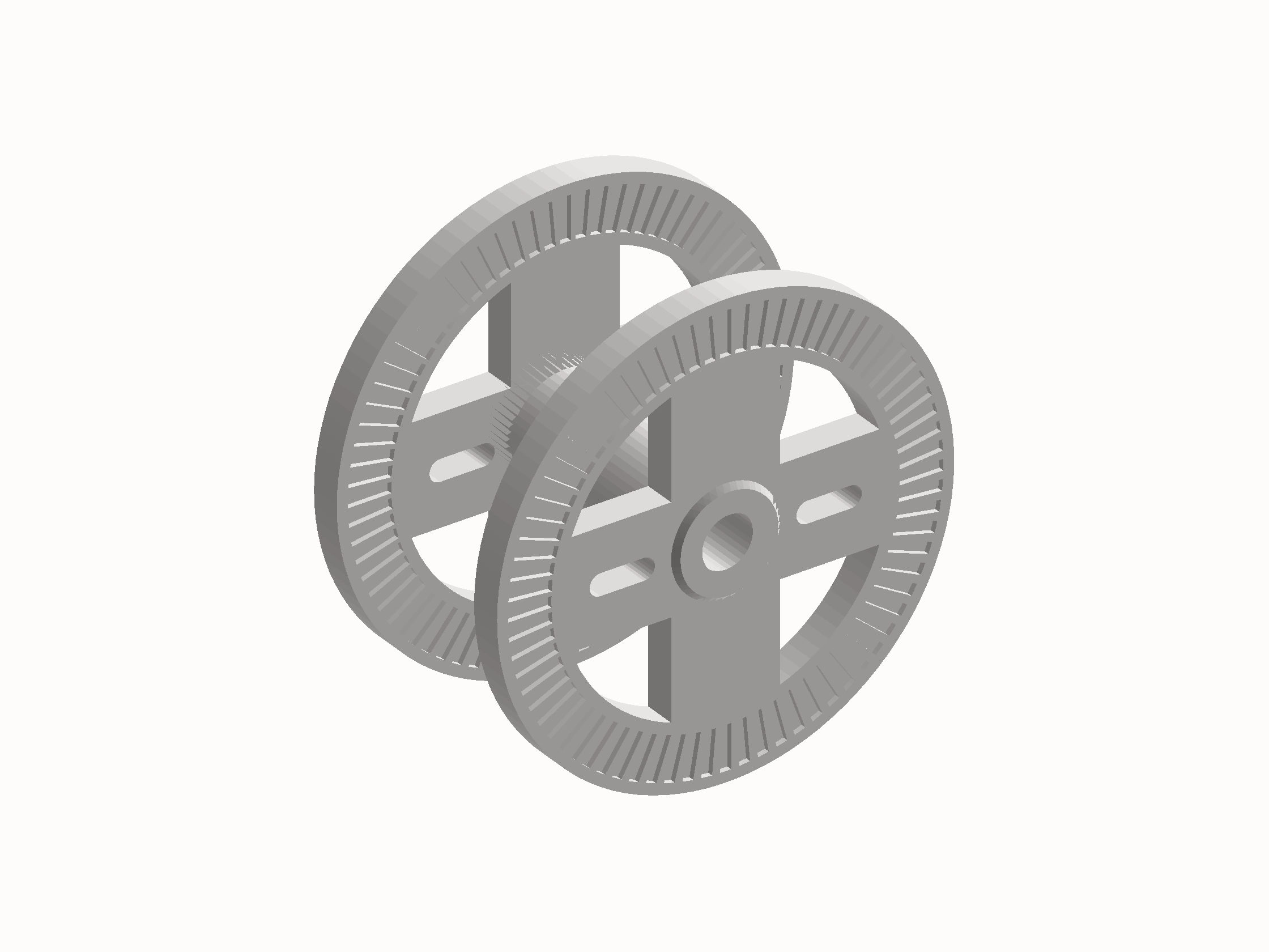 Shaded render of the machine's cable spool: two slotted flange discs on a cross-braced hub.