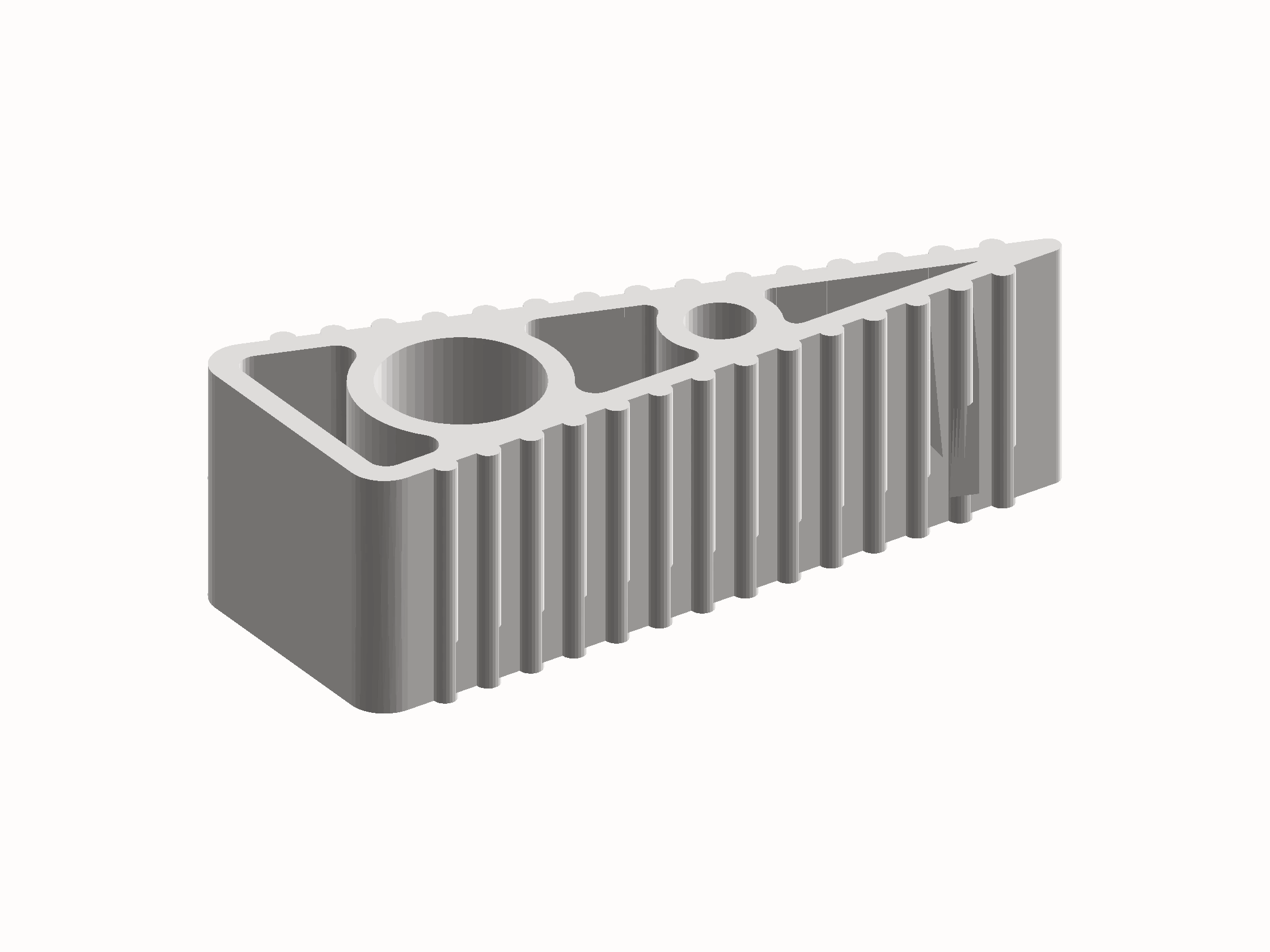 Shaded render of the door stop: a tapered wedge with ribbed side walls, hollowed by two circular bores and a scalloped top edge.